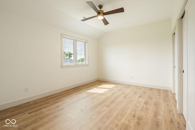 4251 Coventry Dr, Kokomo, IN 46902 - unfurnished bedroom featuring light wood-style floors, baseboards, vaulted ceiling, a closet, and a ceiling fan
