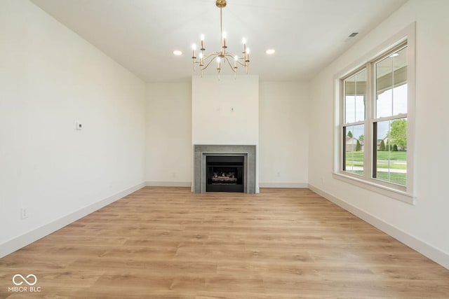 4251 Coventry Dr, Kokomo, IN 46902 - unfurnished living room with recessed lighting, a fireplace, a chandelier, light wood finished floors, and baseboards