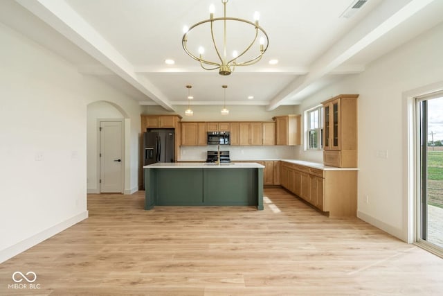 4251 Coventry Dr, Kokomo, IN 46902 - kitchen featuring appliances with stainless steel finishes, light wood-type flooring, a chandelier, healthy amount of natural light, and recessed lighting