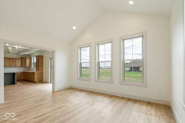 4251 Coventry Dr, Kokomo, IN 46902 - unfurnished living room with a chandelier, light wood finished floors, vaulted ceiling, baseboards, and recessed lighting