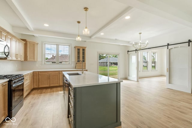 4251 Coventry Dr, Kokomo, IN 46902 - kitchen with black gas range, a sink, beamed ceiling, a barn door, and light wood-style flooring