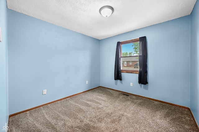 201 Hayden Pike, North Vernon, IN 47265 - empty room with carpet flooring, baseboards, and a textured ceiling