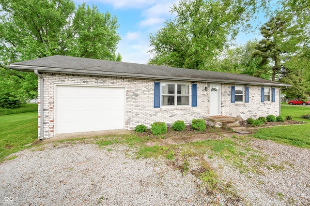 201 Hayden Pike, North Vernon, IN 47265 - ranch-style home with driveway, a garage, a front yard, and brick siding
