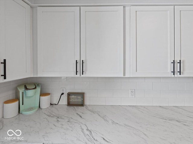 547 W Taylor St, Shelbyville, IN 46176 - kitchen view of white cabinetry, light stone countertops, and tasteful backsplash