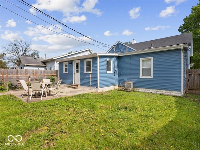 547 W Taylor St, Shelbyville, IN 46176 - rear view of house with cooling unit, entry steps, a patio, and a chimney