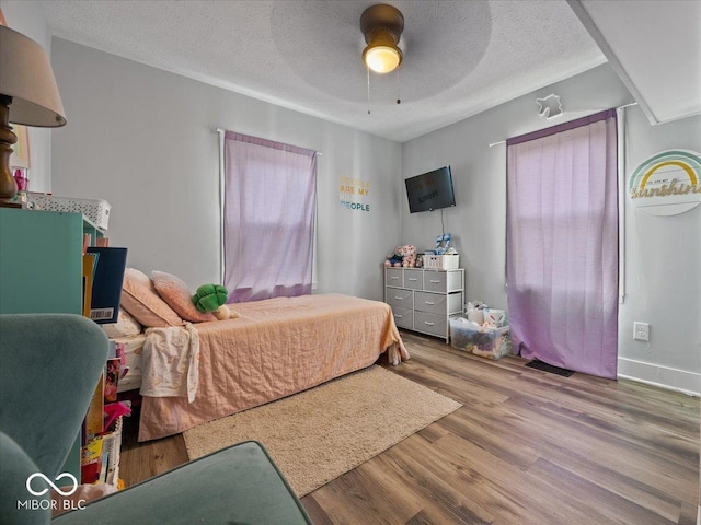547 W Taylor St, Shelbyville, IN 46176 - bedroom with wood finished floors, a textured ceiling, and a ceiling fan