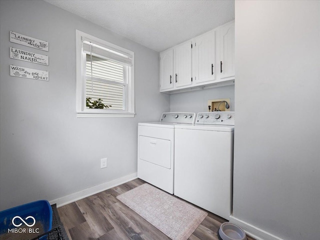 547 W Taylor St, Shelbyville, IN 46176 - washroom featuring cabinet space, washer and clothes dryer, dark wood-style flooring, baseboards, and a textured ceiling