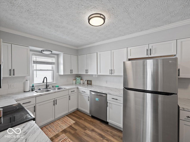 547 W Taylor St, Shelbyville, IN 46176 - kitchen featuring stainless steel appliances, a sink, white cabinetry, crown molding, and a textured ceiling