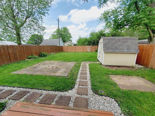 704 E Perry St, Indianapolis, IN 46227 - view of yard with a shed, a patio area, and an outbuilding