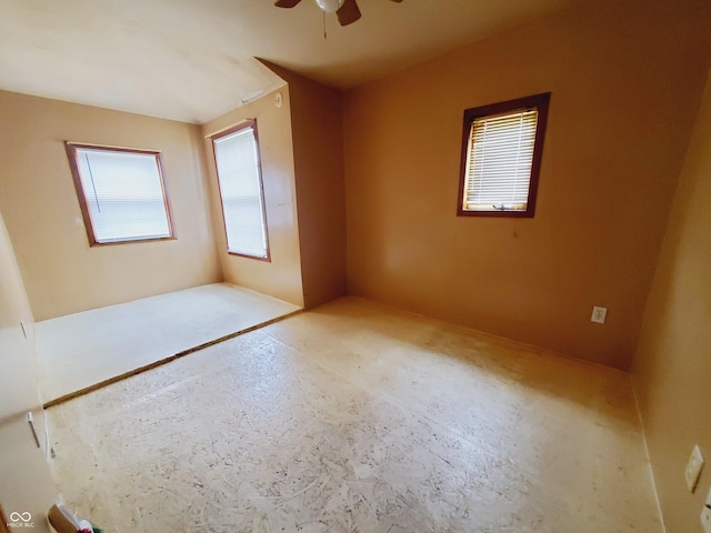 704 E Perry St, Indianapolis, IN 46227 - empty room with concrete flooring and a ceiling fan