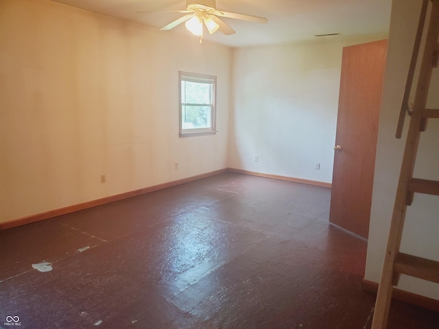 704 E Perry St, Indianapolis, IN 46227 - spare room with a ceiling fan and baseboards