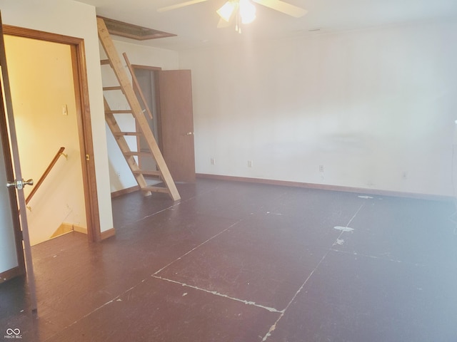 704 E Perry St, Indianapolis, IN 46227 - unfurnished room featuring a ceiling fan, stairway, and baseboards