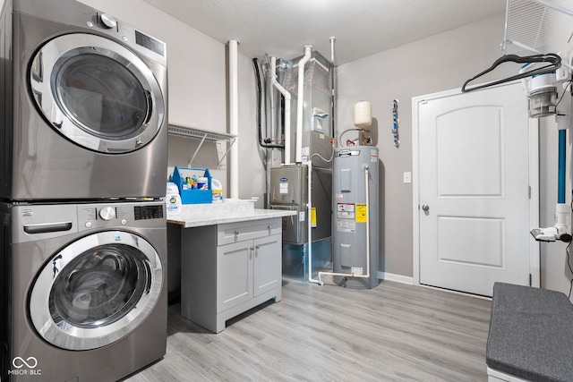 4659 W Otway Ln, New Palestine, IN 46163 - laundry area with water heater, stacked washer and clothes dryer, cabinet space, light wood-style flooring, and heating unit