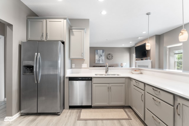 4659 W Otway Ln, New Palestine, IN 46163 - kitchen featuring appliances with stainless steel finishes, a sink, light wood-type flooring, light countertops, and recessed lighting