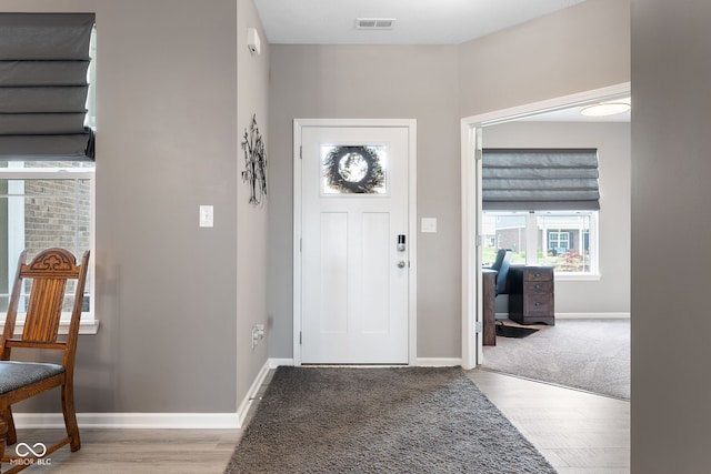 4659 W Otway Ln, New Palestine, IN 46163 - carpeted entrance foyer featuring wood finished floors and baseboards