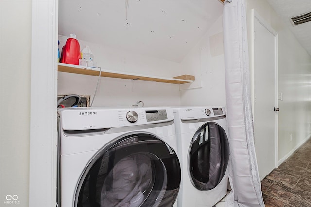 5236 Honey Comb Ln, Indianapolis, IN 46221 - laundry room featuring washer and clothes dryer and stone finish floors