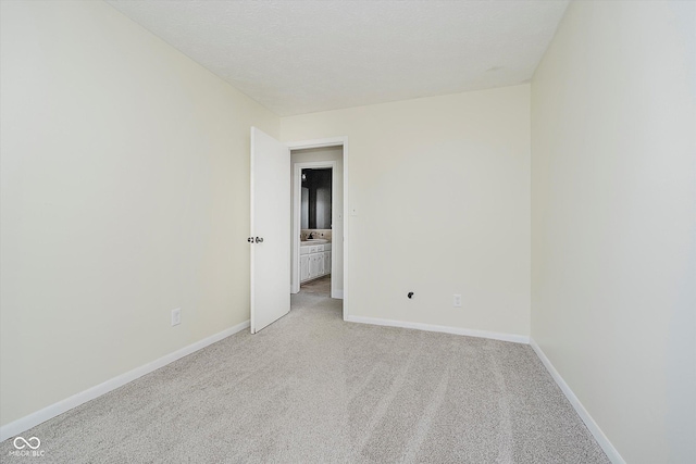 5236 Honey Comb Ln, Indianapolis, IN 46221 - spare room featuring light carpet and baseboards