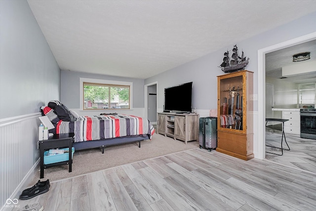 5236 Honey Comb Ln, Indianapolis, IN 46221 - bedroom featuring wood finished floors and wainscoting