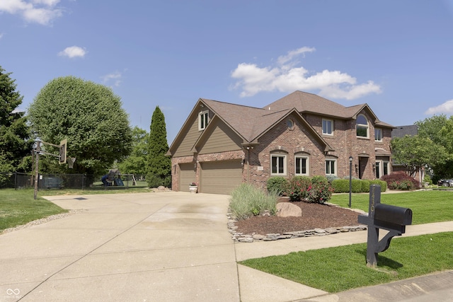 7430 Franklin Parke Woods, Indianapolis, IN 46259 - view of front of house with brick siding, concrete driveway, and a playground