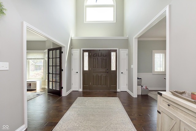 7430 Franklin Parke Woods, Indianapolis, IN 46259 - foyer featuring a towering ceiling, dark wood finished floors, baseboards, and ornamental molding