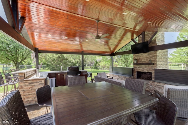7430 Franklin Parke Woods, Indianapolis, IN 46259 - view of patio with an outdoor stone fireplace, an outdoor kitchen, and a ceiling fan