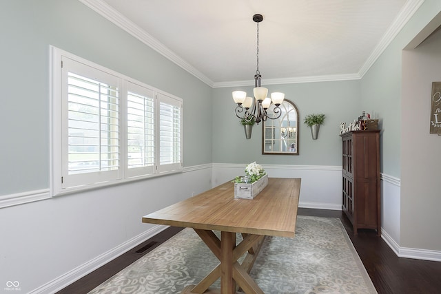 7430 Franklin Parke Woods, Indianapolis, IN 46259 - dining area with a chandelier, dark wood-style flooring, crown molding, and baseboards