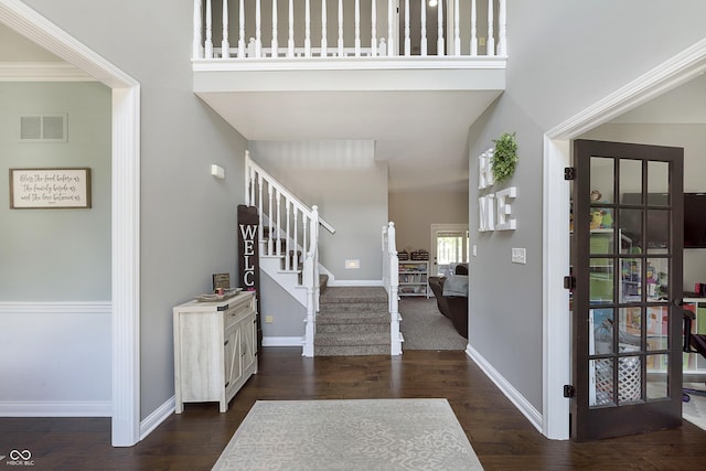 7430 Franklin Parke Woods, Indianapolis, IN 46259 - foyer with stairs, baseboards, dark wood-style flooring, and a high ceiling
