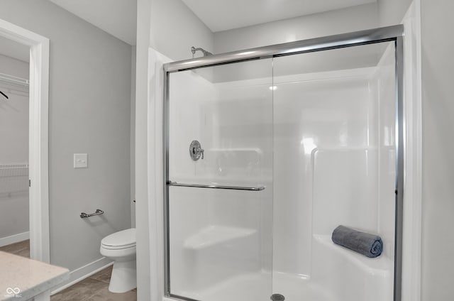 6683 Halsey St, Zionsville, IN 46077 - full bath with a stall shower, toilet, a spacious closet, and baseboards