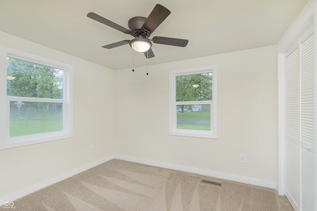 125 S Alfonte St, Ingalls, IN 46048 - unfurnished bedroom featuring multiple windows, carpet floors, and baseboards