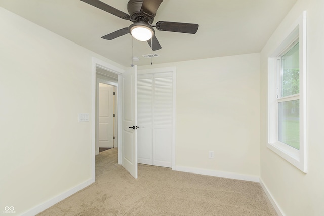 125 S Alfonte St, Ingalls, IN 46048 - spare room with light colored carpet, baseboards, and a ceiling fan