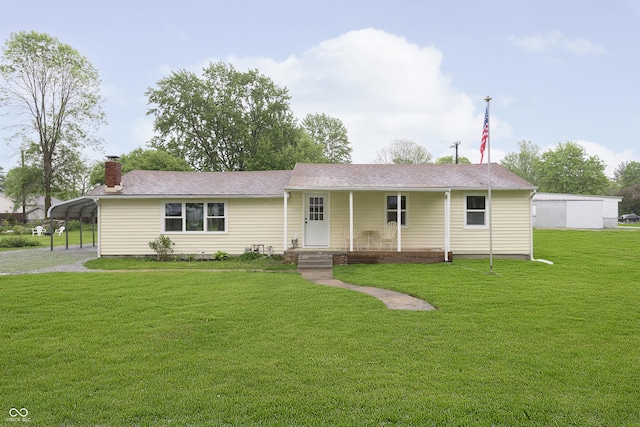 125 S Alfonte St, Ingalls, IN 46048 - view of front of house featuring covered porch, a front lawn, a chimney, a carport, and driveway