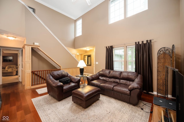 6026 Pennyworth Cir, Indianapolis, IN 46203 - living area with wood finished floors, a high ceiling, plenty of natural light, and crown molding