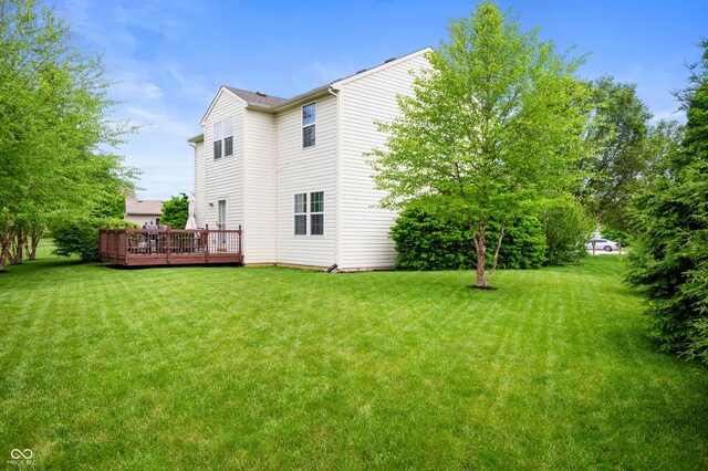 6026 Pennyworth Cir, Indianapolis, IN 46203 - back of property with a deck and a yard