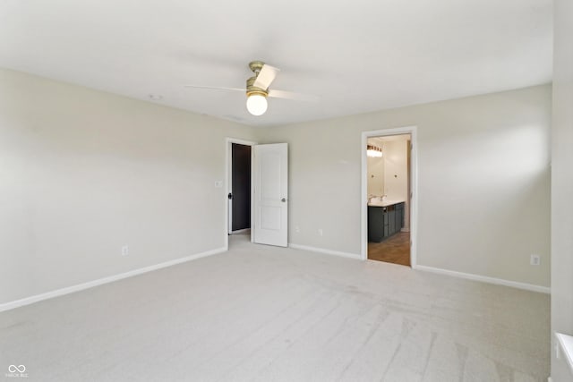 951 Parker Ln, Westfield, IN 46074 - unfurnished bedroom featuring baseboards, light colored carpet, connected bathroom, and a ceiling fan