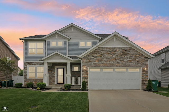951 Parker Ln, Westfield, IN 46074 - view of front of home with stone siding, driveway, a yard, and an attached garage