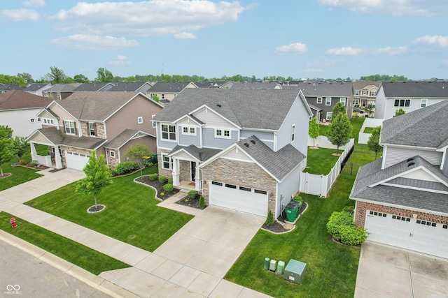 951 Parker Ln, Westfield, IN 46074 - view of front of property with a residential view, stone siding, driveway, a garage, and a shingled roof