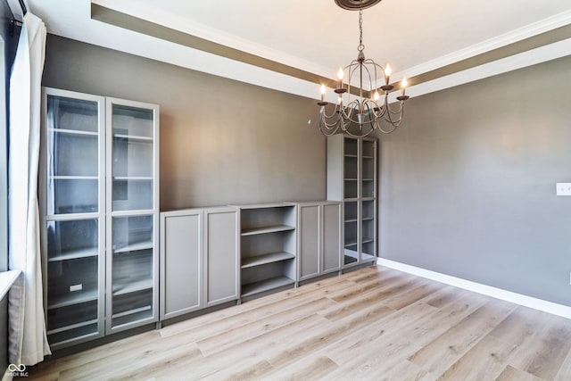 951 Parker Ln, Westfield, IN 46074 - unfurnished room with a chandelier, light wood-type flooring, ornamental molding, baseboards, and a tray ceiling
