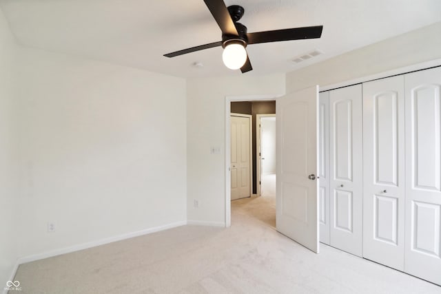 951 Parker Ln, Westfield, IN 46074 - unfurnished bedroom featuring light colored carpet, a closet, baseboards, and ceiling fan