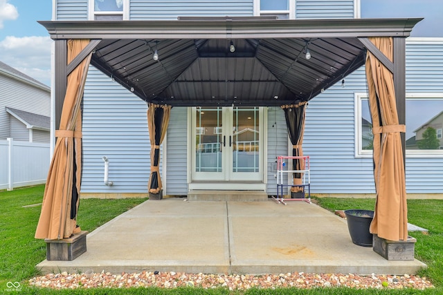 951 Parker Ln, Westfield, IN 46074 - view of exterior entry featuring french doors, a patio, and fence