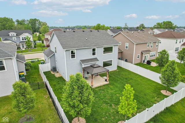 951 Parker Ln, Westfield, IN 46074 - back of property featuring a gazebo, a residential view, central AC unit, and a shingled roof