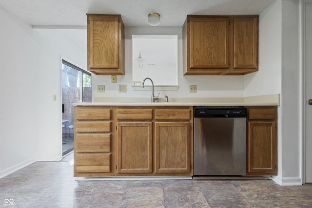 9572 Maple Way, Indianapolis, IN 46268 - kitchen featuring stainless steel dishwasher, brown cabinetry, and a sink