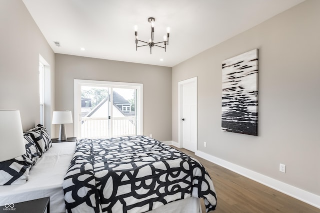 43 N Walcott St, Indianapolis, IN 46201 - bedroom featuring a chandelier, wood finished floors, baseboards, access to exterior, and recessed lighting