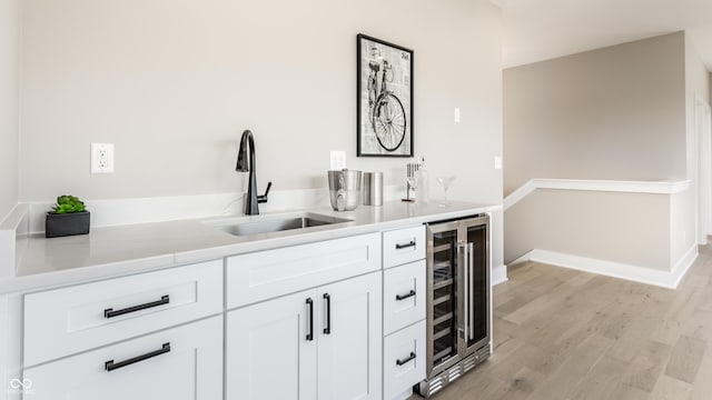 43 N Walcott St, Indianapolis, IN 46201 - indoor bar featuring wine cooler, light wood-style flooring, and baseboards