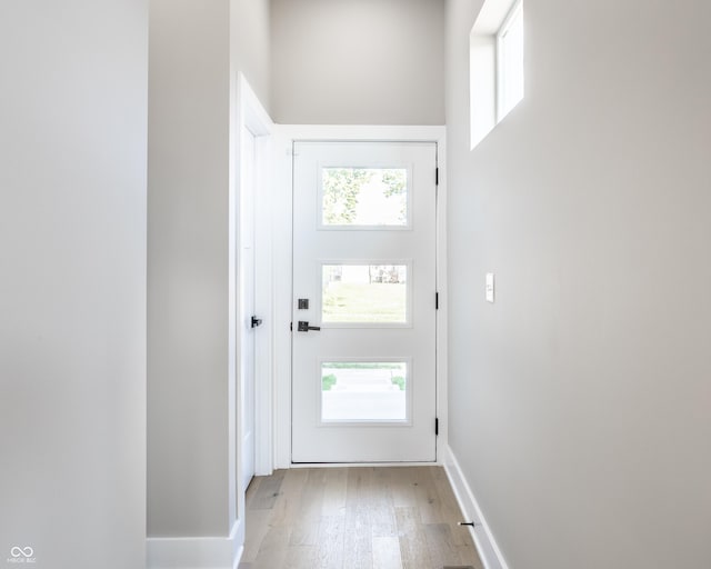 43 N Walcott St, Indianapolis, IN 46201 - entryway with light wood-style flooring and baseboards