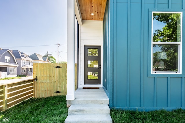 43 N Walcott St, Indianapolis, IN 46201 - doorway to property with board and batten siding and fence