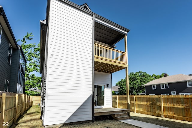 43 N Walcott St, Indianapolis, IN 46201 - rear view of property featuring a balcony and a fenced backyard