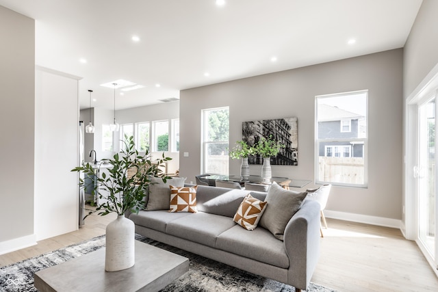 43 N Walcott St, Indianapolis, IN 46201 - living area featuring light wood-style floors, plenty of natural light, recessed lighting, and baseboards