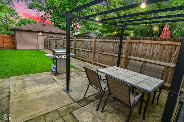 1236 Central Ave, Indianapolis, IN 46202 - patio terrace at dusk featuring outdoor dining space, a grill, a patio, a pergola, and a fenced backyard