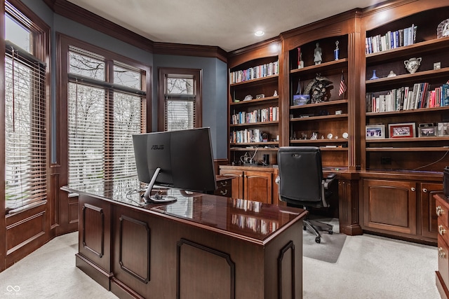 office area with light carpet, crown molding, and built in features