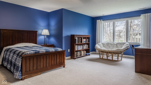 bedroom featuring carpet floors and baseboards